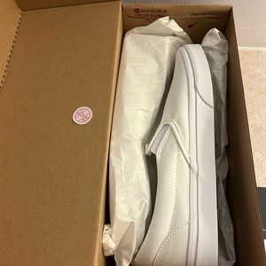 Brand new white vans slip ons
